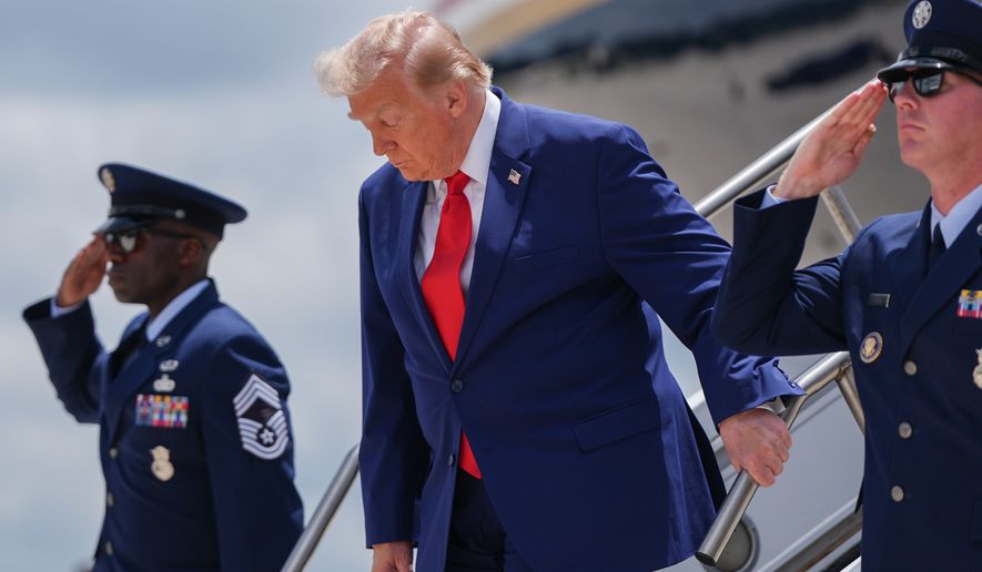 President Donald Trump arrives on Air Force One at Dobbins Air Reserve Base, Wednesday, July 22, 2026, in Marietta, Ga. (AP Photo/Julia Demaree Nikhinson)