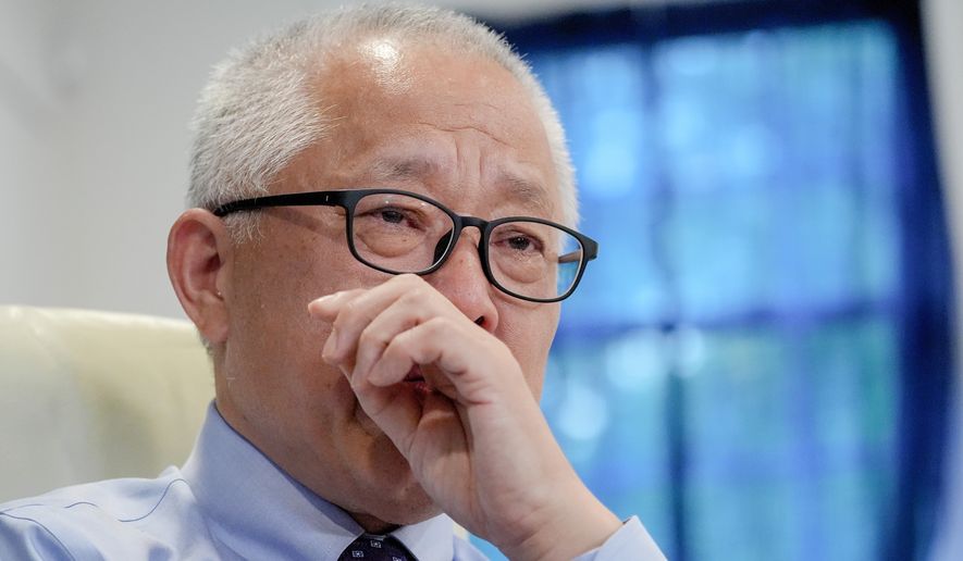 Chinese pastor Ezra Jin Mingri becomes emotional during an interview with The Associated Press in Maryland, Wednesday, July 22, 2026 . (AP Photo/Mariam Zuhaib)