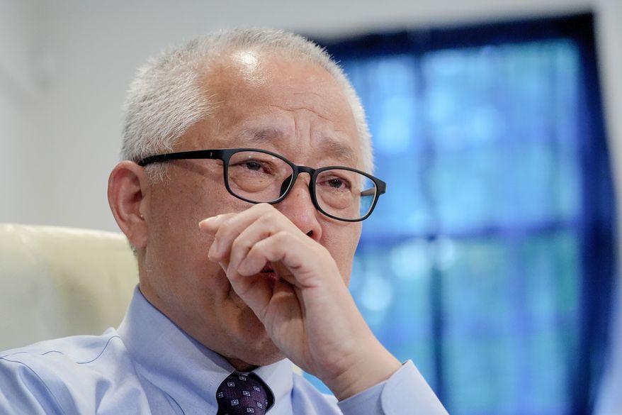 Chinese pastor Ezra Jin Mingri becomes emotional during an interview with The Associated Press in Maryland, Wednesday, July 22, 2026 . (AP Photo/Mariam Zuhaib)