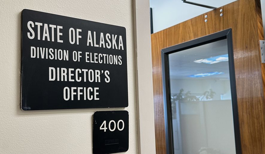 FILE - A sign hangs outside the director's office of the Alaska Division of Elections, March 19, 2026, in Juneau, Alaska. (AP Photo/Becky Bohrer, File)