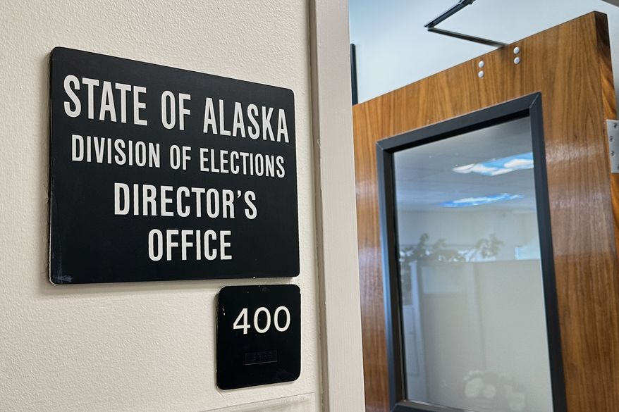 FILE - A sign hangs outside the director's office of the Alaska Division of Elections, March 19, 2026, in Juneau, Alaska. (AP Photo/Becky Bohrer, File)