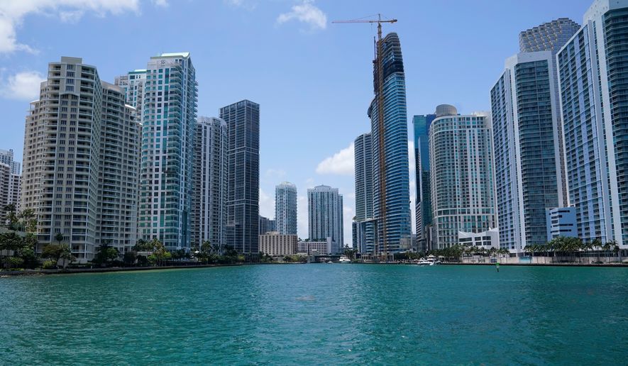 FILE - High-rise buildings at the mouth of the Miami River are seen from Biscayne Bay, May 9, 2022, in Miami. (AP Photo/Lynne Sladky, File)
