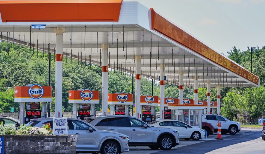 FILE - Cars line up at the pumps of a Gulf Oil station on the Massachusetts Turnpike near Boston, Sunday, July 19, 2026. (AP Photo/Gene J. Puskar, File)