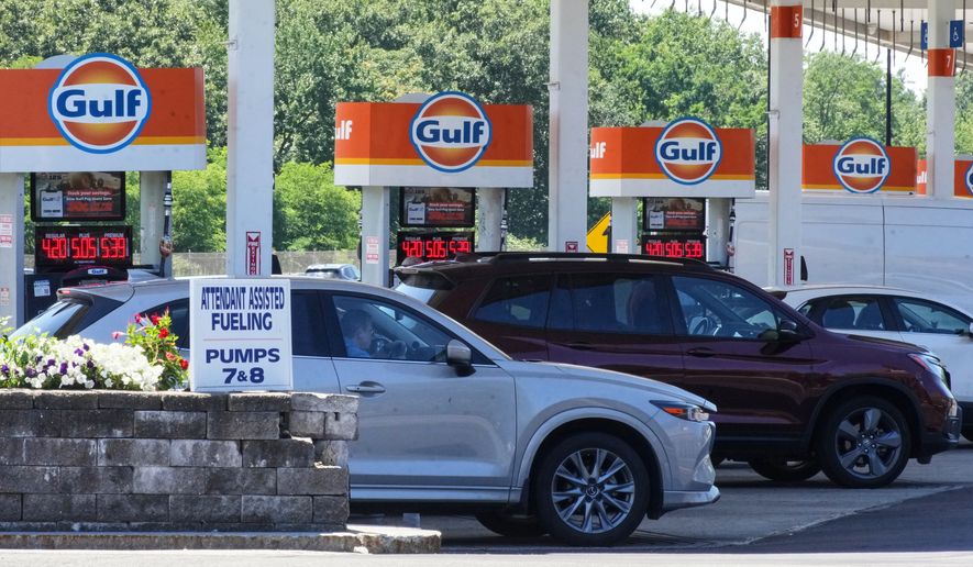 FILE - Cars line up at the pumps of a Gulf Oil station on the Massachusetts Turnpike near Boston, Sunday, July 19, 2026. (AP Photo/Gene J. Puskar, File)