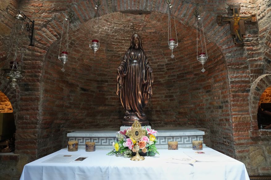 A statue of Mary modeled after the one in Turkey, alongside a relic said to be from her veil inside the Ephesus House, a replica of the House of the Virgin Mary in Ephesus, Turkey, at Alfonso town, Cavite province, Philippines on July 16, 2026. (AP Photo/Aaron Favila)