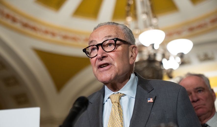 Senate Minority Leader Chuck Schumer, D-N.Y., speaks to reporters following a weekly policy luncheon at the U.S. Capitol in Washington, Tuesday, July 21, 2026. (AP Photo/Allison Robbert) ** FILE **