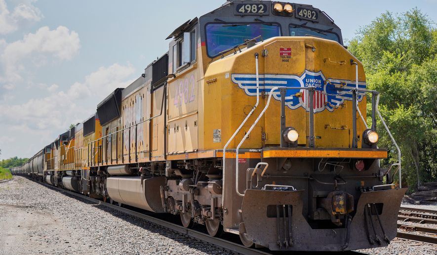 FILE - A Union Pacific train travels through Union, Neb., July 31, 2018. (AP Photo/Nati Harnik, File)