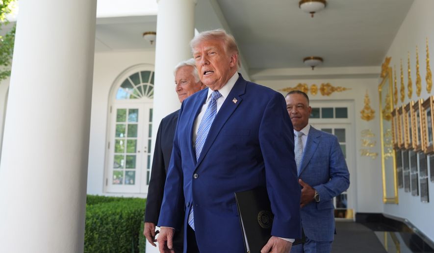 President Donald Trump arrives with Los Angeles Dodgers manager Dave Roberts and owner Mark Walter for an event to honor the 2025 World Series champions Los Angeles Dodgers in the Rose Garden of the White House, Thursday, July 23, 2026, in Washington. (AP Photo/Alex Brandon)