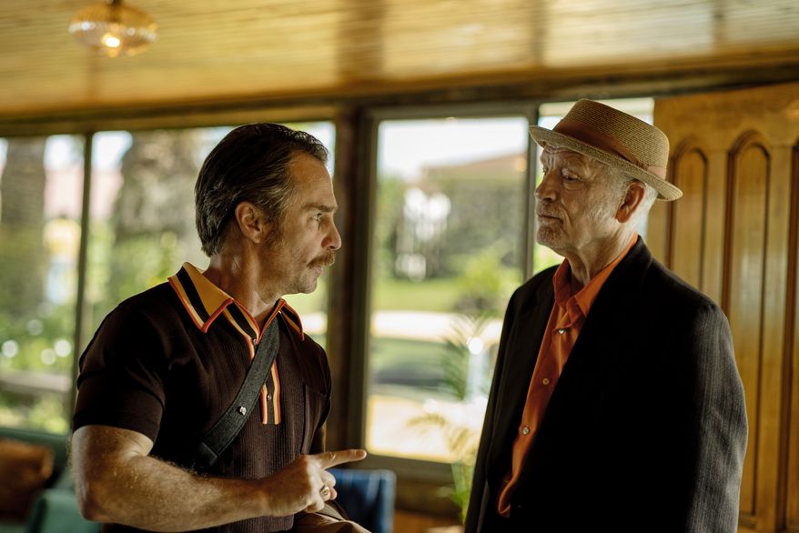 This image released by Searchlight Pictures shows Sam Rockwell, left, and John Malkovich in a scene from "Wild Horse Nine." (Diego Araya Corvalán/Searchlight Pictures via AP)