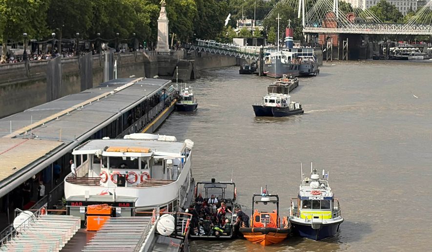Emergency services attend an incident at Westminster Bridge in London, Friday July 24, 2026, after a police boat crashed into Westminster Bridge. (David Lynch/PA via AP)