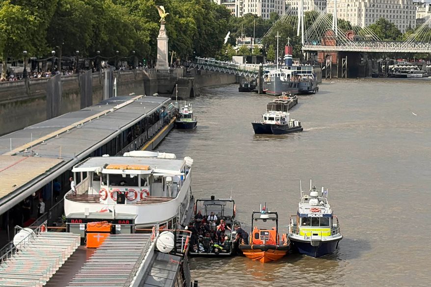 Emergency services attend an incident at Westminster Bridge in London, Friday July 24, 2026, after a police boat crashed into Westminster Bridge. (David Lynch/PA via AP)