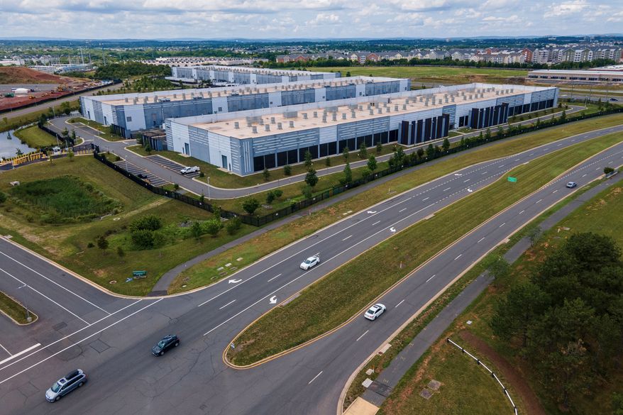 Cars drive past data centers in Ashburn, Va., on July 16, 2023. (AP Photo/Ted Shaffrey) **FILE**