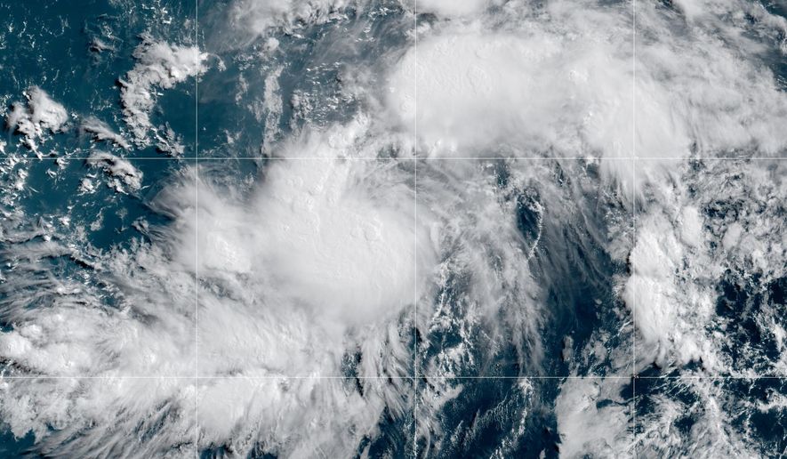 This GOES-19 GeoColor satellite image provided by NOAA shows Tropical Storm Genevieve in the Eastern Pacific on Friday, July 24, 2026. (NOAA via AP)
