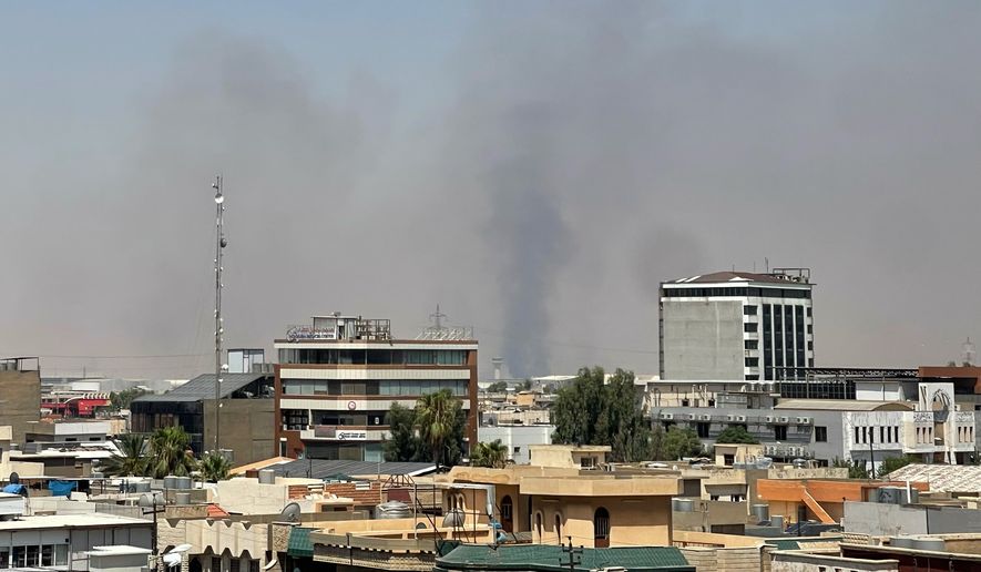 Black smoke rises following explosions near a military base hosting U.S. forces in the northern Iraqi city of Irbil, Friday, July 24, 2026. (AP Photo/Stella Martany)