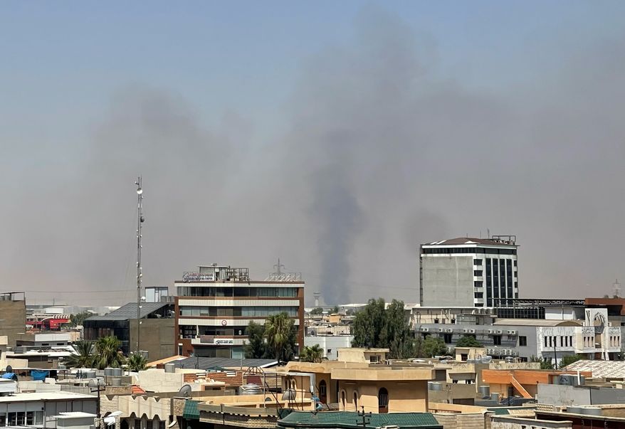 Black smoke rises following explosions near a military base hosting U.S. forces in the northern Iraqi city of Irbil, Friday, July 24, 2026. (AP Photo/Stella Martany)