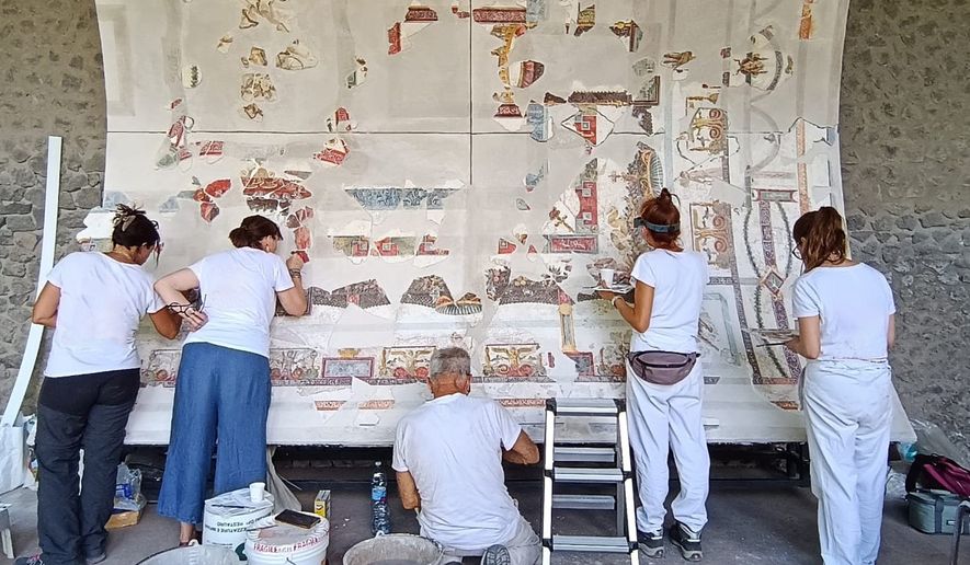 In this picture made available by the Archaeological Park of Pompeii, Friday, July 24, 2026, part of the restored ceiling of the Bakery House is displayed at the Pompeii Archaeological site. (Parco Archeologico di Pompei via AP)