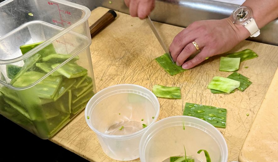 Nopales from the prickly pear cactus are prepared at Californios in San Francisco on Thursday, July 16, 2026. (AP Photo/Haven Daley)