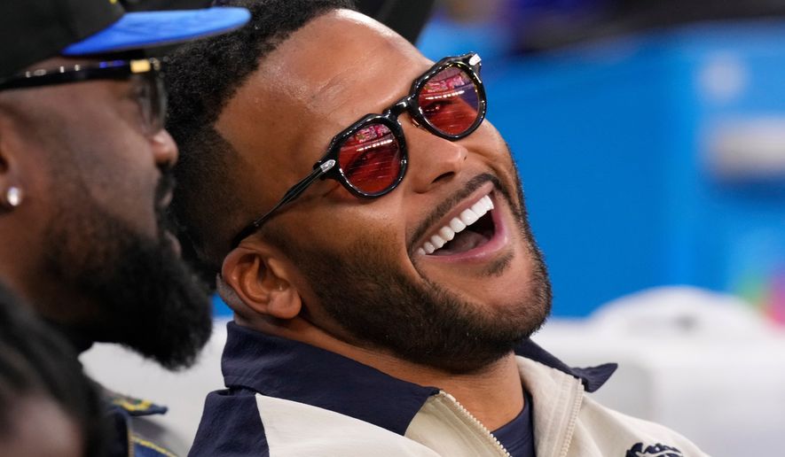FILE - Former Los Angeles Rams player Aaron Donald looks on before an NFL football game between the Los Angeles Rams and the Tampa Bay Buccaneers, Nov. 23, 2025, in Inglewood, Calif. (AP Photo/Mark J. Terrill, File)