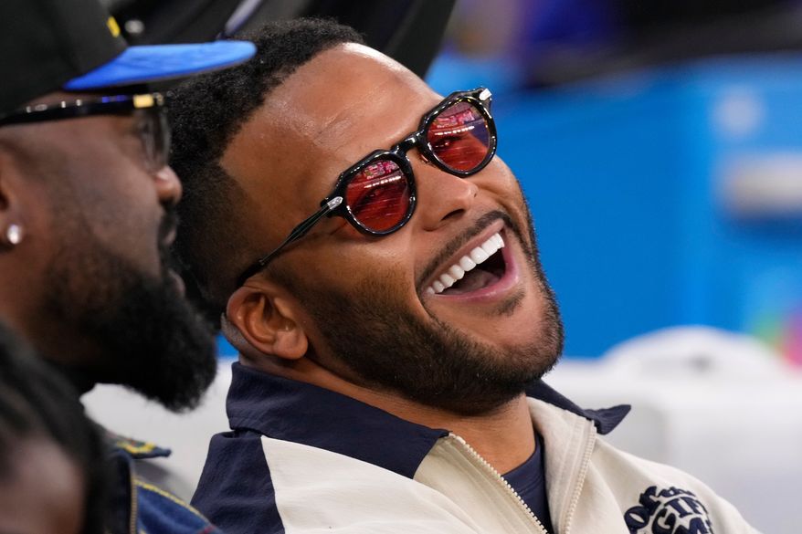 FILE - Former Los Angeles Rams player Aaron Donald looks on before an NFL football game between the Los Angeles Rams and the Tampa Bay Buccaneers, Nov. 23, 2025, in Inglewood, Calif. (AP Photo/Mark J. Terrill, File)