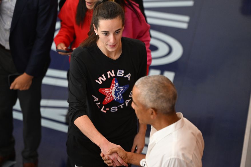 Former President Barack Obama shakes hands with WNBA All-Star Caitlin Clark during a practice at the Obama Presidential Center in Chicago, Friday, July 24, 2026. (AP Photo/Paul Beaty)