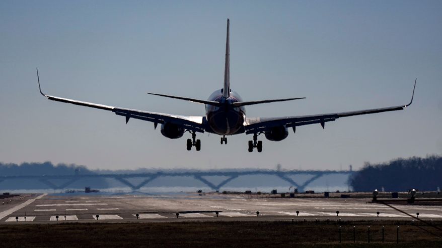A plane lands at Ronald Reagan Washington National Airport in Arlington, Va., Dec. 30, 2022. (AP Photo/Carolyn Kaster, File)