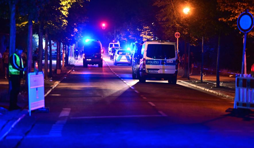 Police officers are on the scene following the cancellation of Christopher Street Day in Berlin, on Saturday, July 25, 2026. (Fabian Sommer/dpa/dpa via AP)