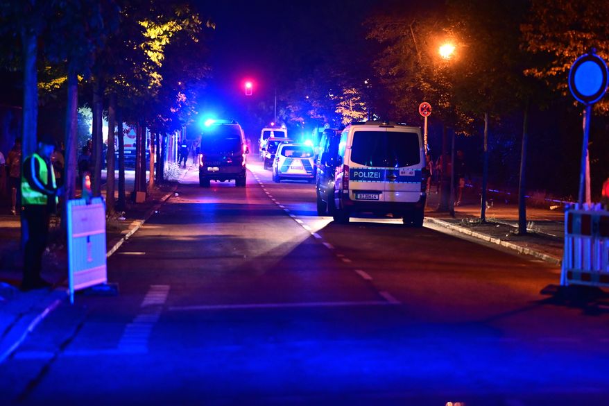 Police officers are on the scene following the cancellation of Christopher Street Day in Berlin, on Saturday, July 25, 2026. (Fabian Sommer/dpa/dpa via AP)