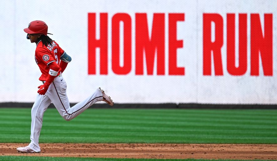 Washington Nationals' CJ Abrams runs around the bases after hitting a two-run home run during the fifth inning of a baseball game against the Arizona Diamondbacks, Sunday, July 26, 2026, in Washington. (AP Photo/John McDonnell)