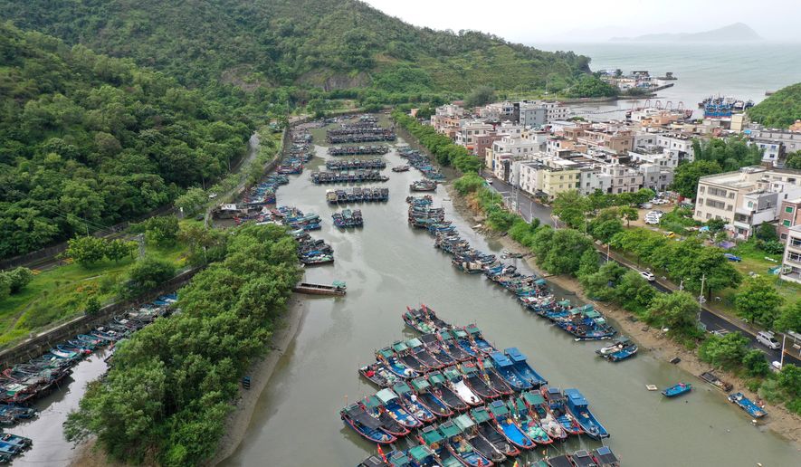 In this photo released by Xinhua News Agency, a drone photo shows fishing boats taking shelter ahead of Typhoon Noul at a port in Shenzhen-Shanwei Special Cooperation Zone in southern China's Guangdong Province on Saturday, July 25, 2026. (Lu Hanxin/Xinhua via AP)