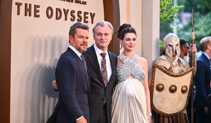 Matt Damon, from left, director Christopher Nolan, and Anne Hathaway attend the premiere of "The Odyssey" at AMC Lincoln Square on Tuesday, July 14, 2026, in New York. (Photo by Evan Agostini/Invision/AP)