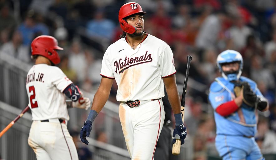 Washington Nationals' James Wood, center, walks back to the dugout after striking out during the seventh inning of a baseball game against the Toronto Blue Jays, Monday, July 27, 2026, in Washington. (AP Photo/John McDonnell) ** FILE **
