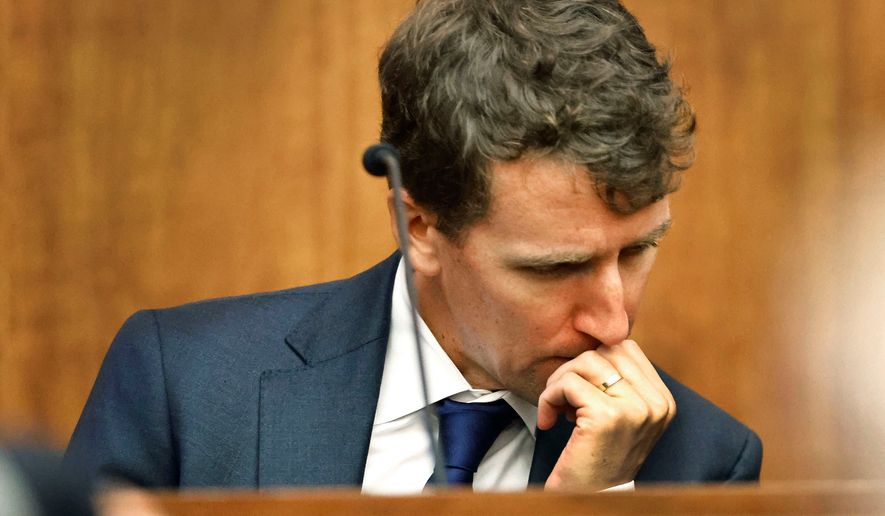 Patrick Clancy reacts as images of himself and his children on vacation a month before they were killed is shown in the courtroom at Plymouth Superior Court in Plymouth, Mass., Monday, July 27, 2026. (Greg Derr/The Patriot Ledger via AP, Pool)