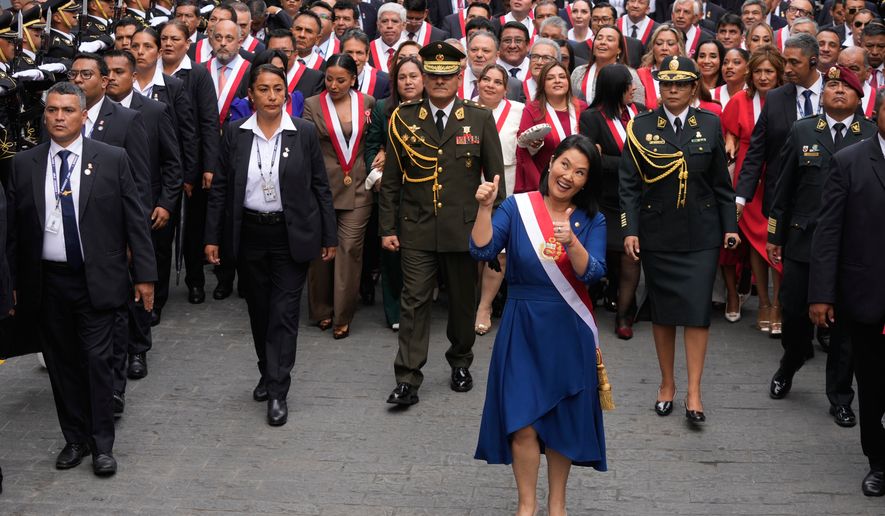 Peru's President Keiko Fujimori walks to the presidential palace after her inauguration in Lima, Peru, Tuesday, July 28, 2026. (AP Photo/Martin Mejia)