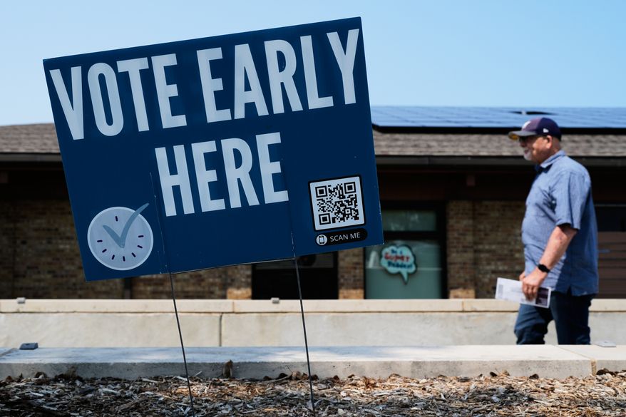 A voter walks to polling place in Milwaukee, Tuesday, July 28, 2026. (AP Photo/Nam Y. Huh)