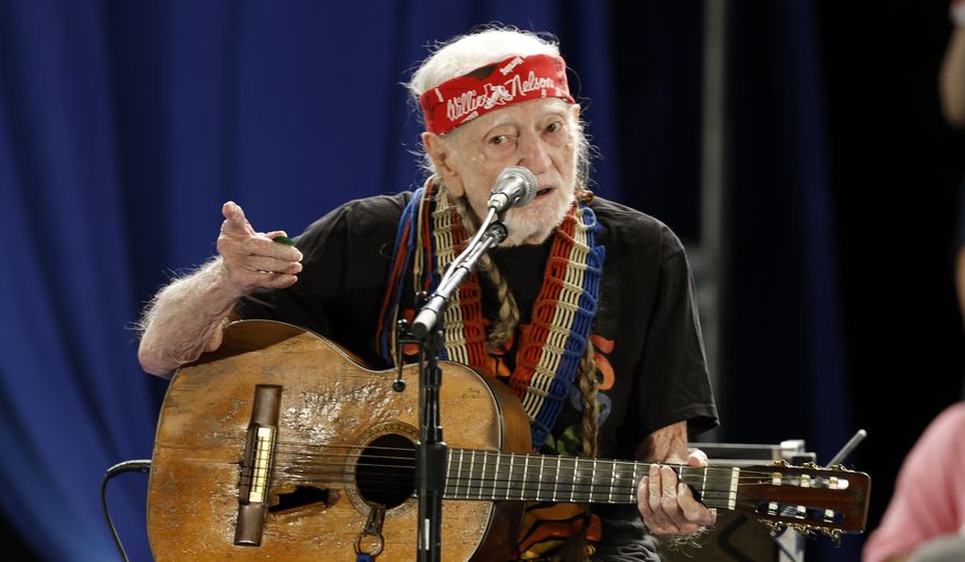 Willie Nelson performs during a campaign rally for Democratic presidential nominee Vice President Kamala Harris, Friday, Oct. 25, 2024, in Houston. (AP Photo/Annie Mulligan)