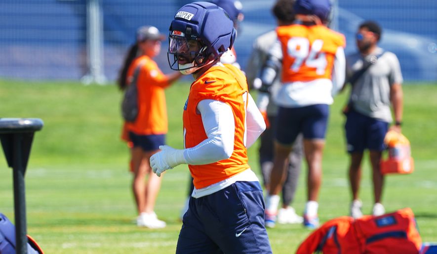 Denver Broncos linebacker Jonathon Cooper takes part in drills during a practice at the team's NFL football training camp, Wednesday, July 29, 2026, in Centennial, Colo. (AP Photo/David Zalubowski)
