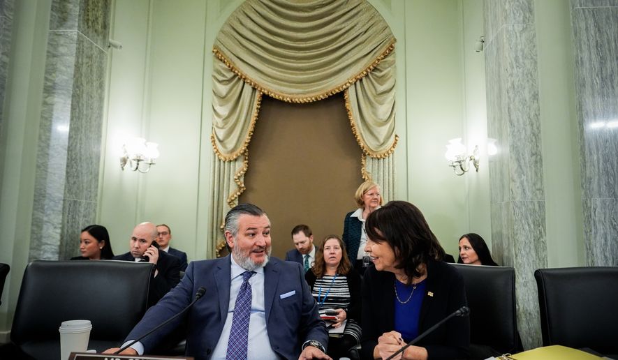 FILE - Sen. Ted Cruz, R-Texas, left, chairman of the Senate Commerce, Science and Transportation Committee, speaks with Sen. Maria Cantwell, D-Wash., right, before a hearing Wednesday, Nov. 19, 2025, on Capitol Hill in Washington. (AP Photo/Julia Demaree Nikhinson,File)