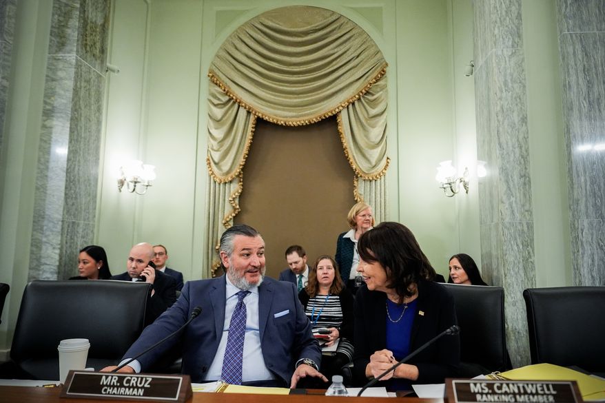 FILE - Sen. Ted Cruz, R-Texas, left, chairman of the Senate Commerce, Science and Transportation Committee, speaks with Sen. Maria Cantwell, D-Wash., right, before a hearing Wednesday, Nov. 19, 2025, on Capitol Hill in Washington. (AP Photo/Julia Demaree Nikhinson,File)