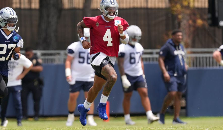 Dallas Cowboys quarterback Dak Prescott runs during the NFL football team's training camp, Wednesday, July 29, 2026, in Oxnard, Calif. (AP Photo/Mark J. Terrill)