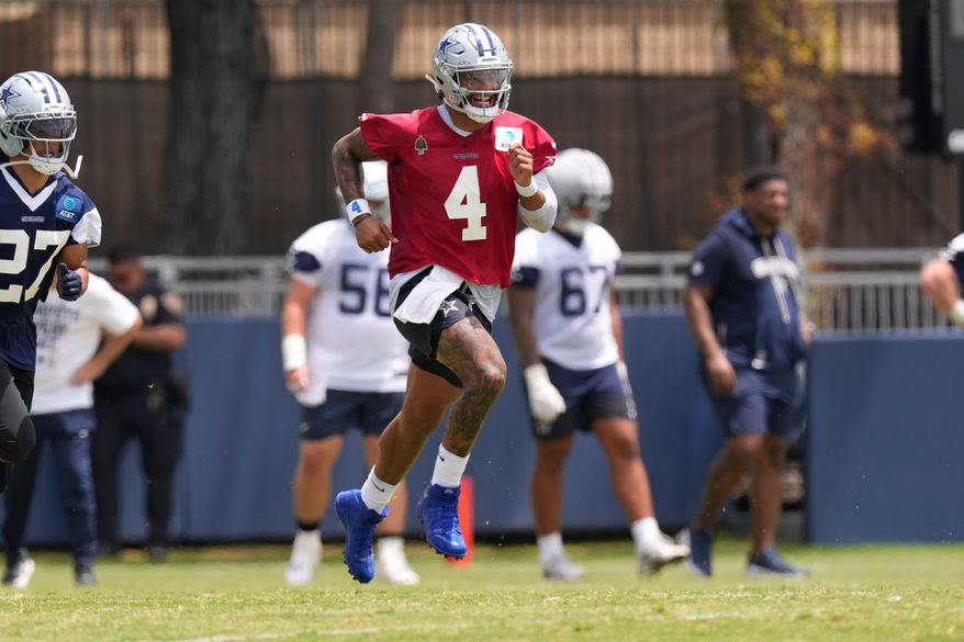 Dallas Cowboys quarterback Dak Prescott runs during the NFL football team's training camp, Wednesday, July 29, 2026, in Oxnard, Calif. (AP Photo/Mark J. Terrill)