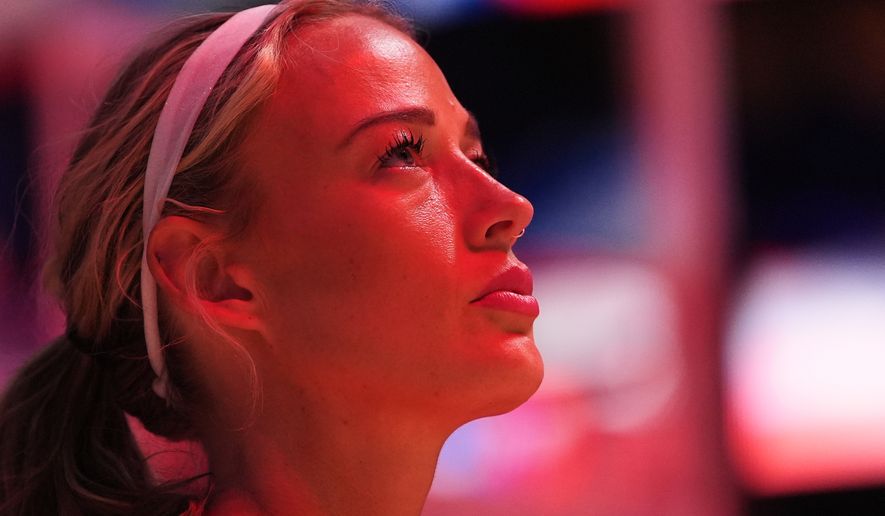 Indiana Fever guard Sophie Cunningham looks on during the national anthem before facing the Seattle Storm a WNBA basketball game, Tuesday, July 28, 2026, in Seattle. (AP Photo/Lindsey Wasson)