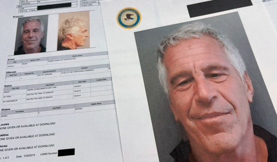 FILE - Documents that were included in the U.S. Department of Justice release of the Jeffrey Epstein files are photographed on Jan. 2, 2026. (AP Photo/Jon Elswick, File)