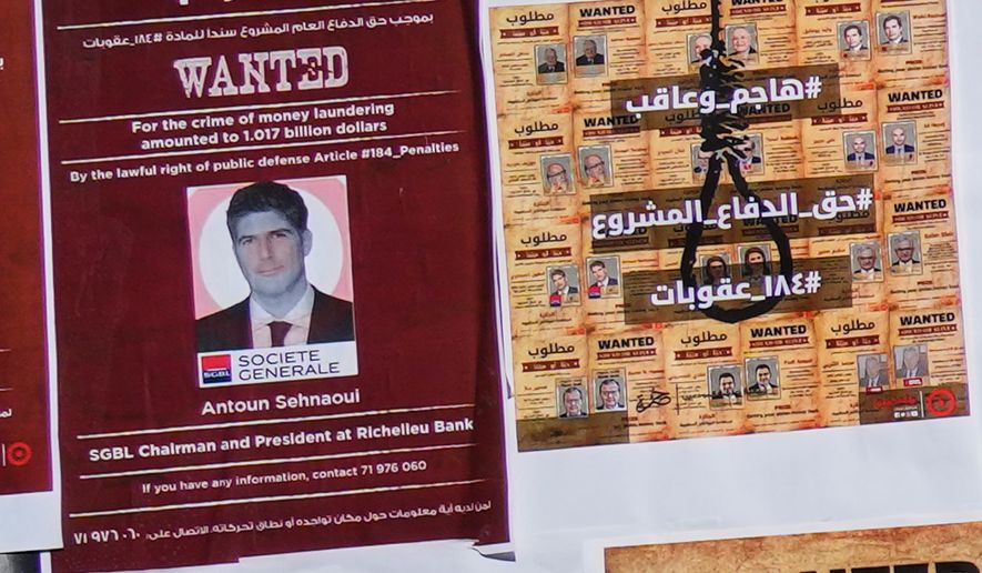 A mock "wanted" poster of Lebanese bank owner Antoun Sehnaoui, left, plastered by depositors protesters outside the Lebanese Central Bank, in Beirut, Lebanon, Friday, Jan. 19, 2024. More than a dozen Lebanese lawyers on Wednesday, July 29, 2026, filed a complaint at the prosecutors' office in Beirut on Wednesday against a prominent local banker, saying he violated the country's laws by meeting with Israeli Prime Minister Benjamin Netanyahu in Washington this week. (AP Photo/Hussein Malla)