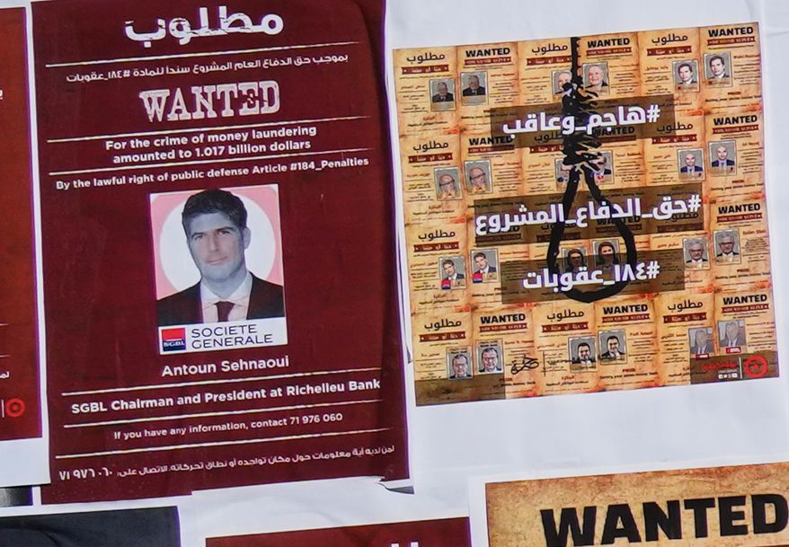 A mock "wanted" poster of Lebanese bank owner Antoun Sehnaoui, left, plastered by depositors protesters outside the Lebanese Central Bank, in Beirut, Lebanon, Friday, Jan. 19, 2024. More than a dozen Lebanese lawyers on Wednesday, July 29, 2026, filed a complaint at the prosecutors' office in Beirut on Wednesday against a prominent local banker, saying he violated the country's laws by meeting with Israeli Prime Minister Benjamin Netanyahu in Washington this week. (AP Photo/Hussein Malla)