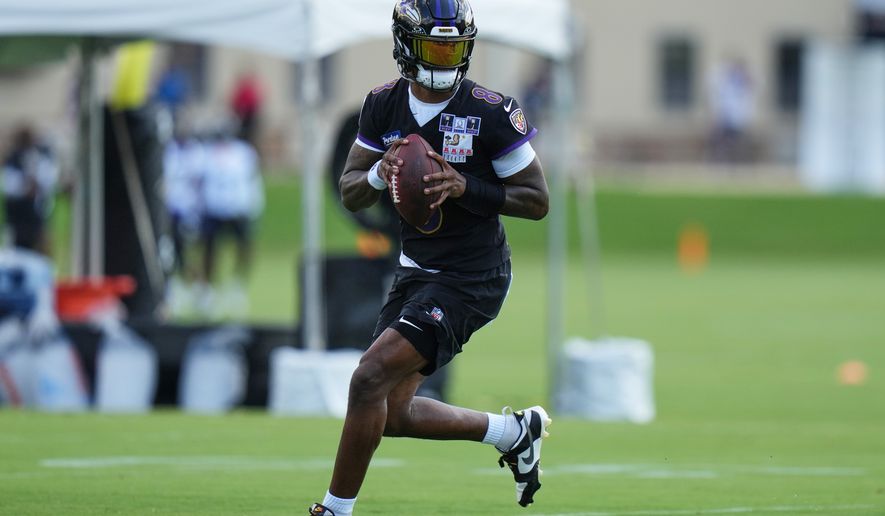 Baltimore Ravens quarterback Lamar Jackson (8) works out during practice at the team's NFL football training camp, Wednesday, July 29, 2026, at the Under Armour Performance Center in Owings Mills, Md. (AP Photo/Stephanie Scarbrough)