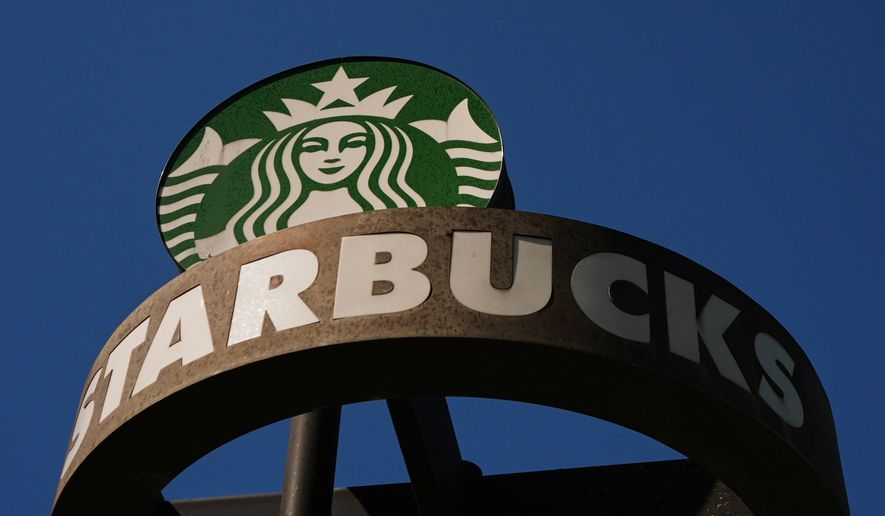 FILE - A Starbucks sign is seen outside the coffee company's global corporate headquarters, May 11, 2026, in Seattle. (AP Photo/Lindsey Wasson, File)
