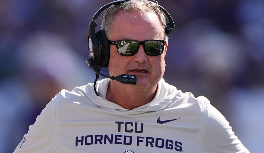 FILE - TCU head coach Sonny Dykes watches during the first half of an NCAA college football game against Kansas State, Oct. 11, 2025, in Manhattan, Kan. (AP Photo/Charlie Riedel, File)