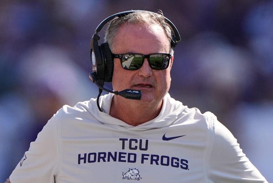 FILE - TCU head coach Sonny Dykes watches during the first half of an NCAA college football game against Kansas State, Oct. 11, 2025, in Manhattan, Kan. (AP Photo/Charlie Riedel, File)