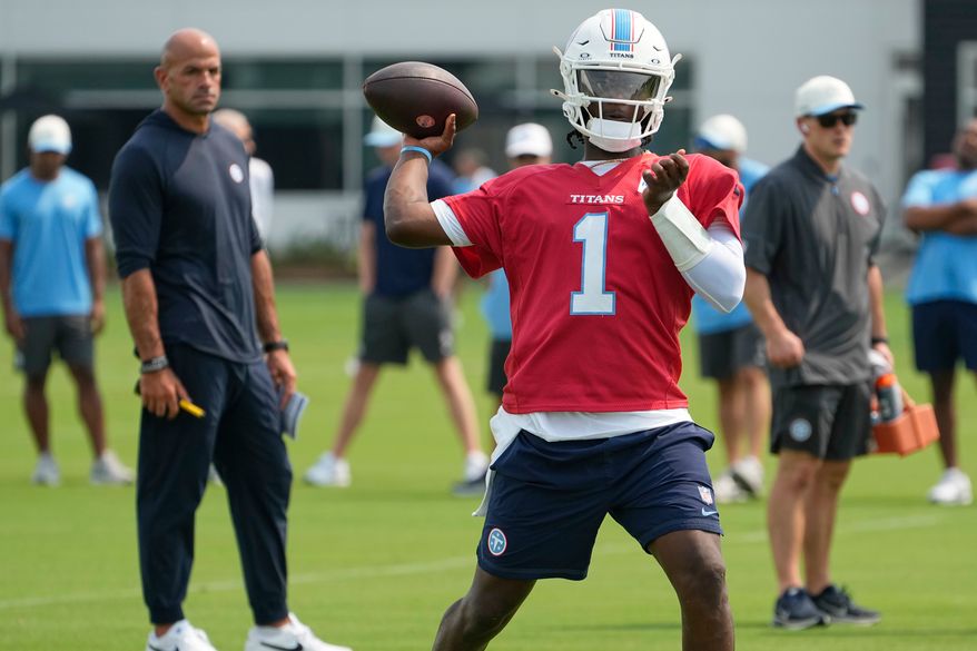 Tennessee Titans quarterback Cam Ward (1) looks to throw a pass during the NFL football team's training camp Wednesday, July 29, 2026, in Nashville, Tenn. (AP Photo/George Walker IV)