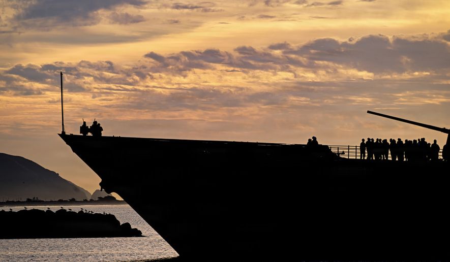 Guided-missile cruiser USS Chosin (CG 65) is silhouetted by the sunrise as it approaches the Port of Hueneme on Jan. 26, 2026. U.S. Navy cruisers are designed to provide air and surface protection for carrier strike groups, utilizing advanced missile systems like the Aegis Combat System. USS Chosin, a Ticonderoga-class guided-missile cruiser, was commissioned in 1991 and is homeported in San Diego. (U.S. Navy photo by Dana Rene White)
